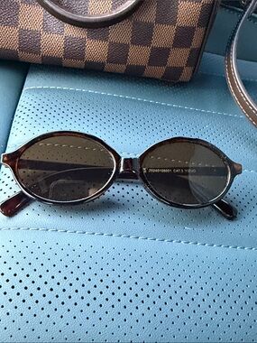 Eve Oval Tortoiseshell Sunglasses with Dark Lenses